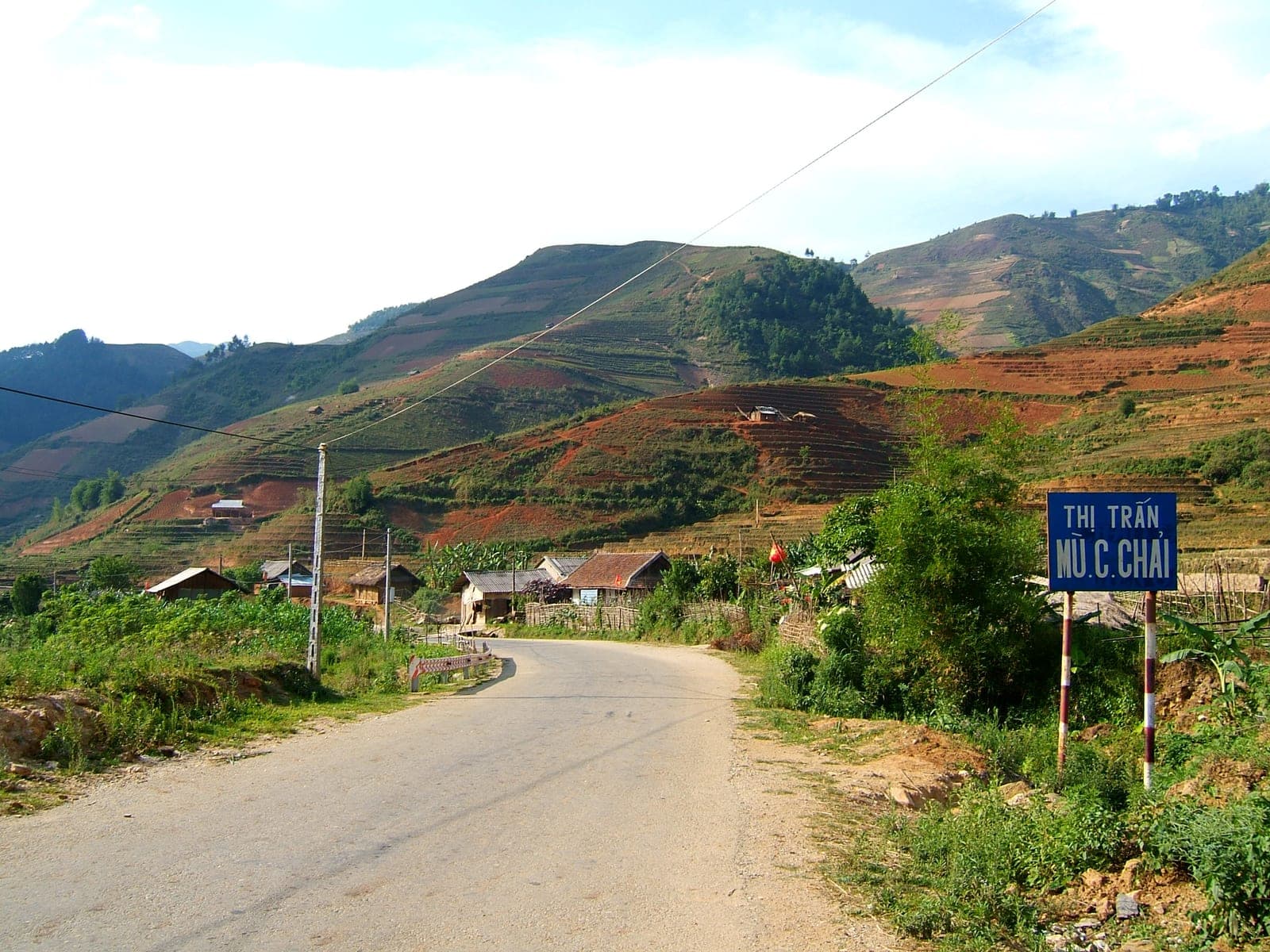 Golden rice terraces cascading down mountainsides in Mu Cang Chai, Yên Bái province, during autumn harvest season.