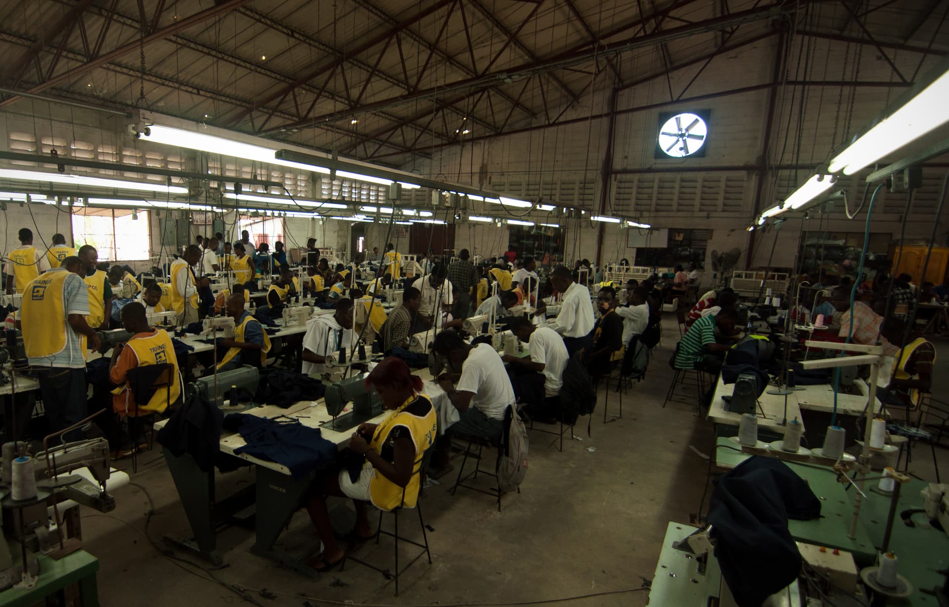 Garment trainees working at sewing machines during training