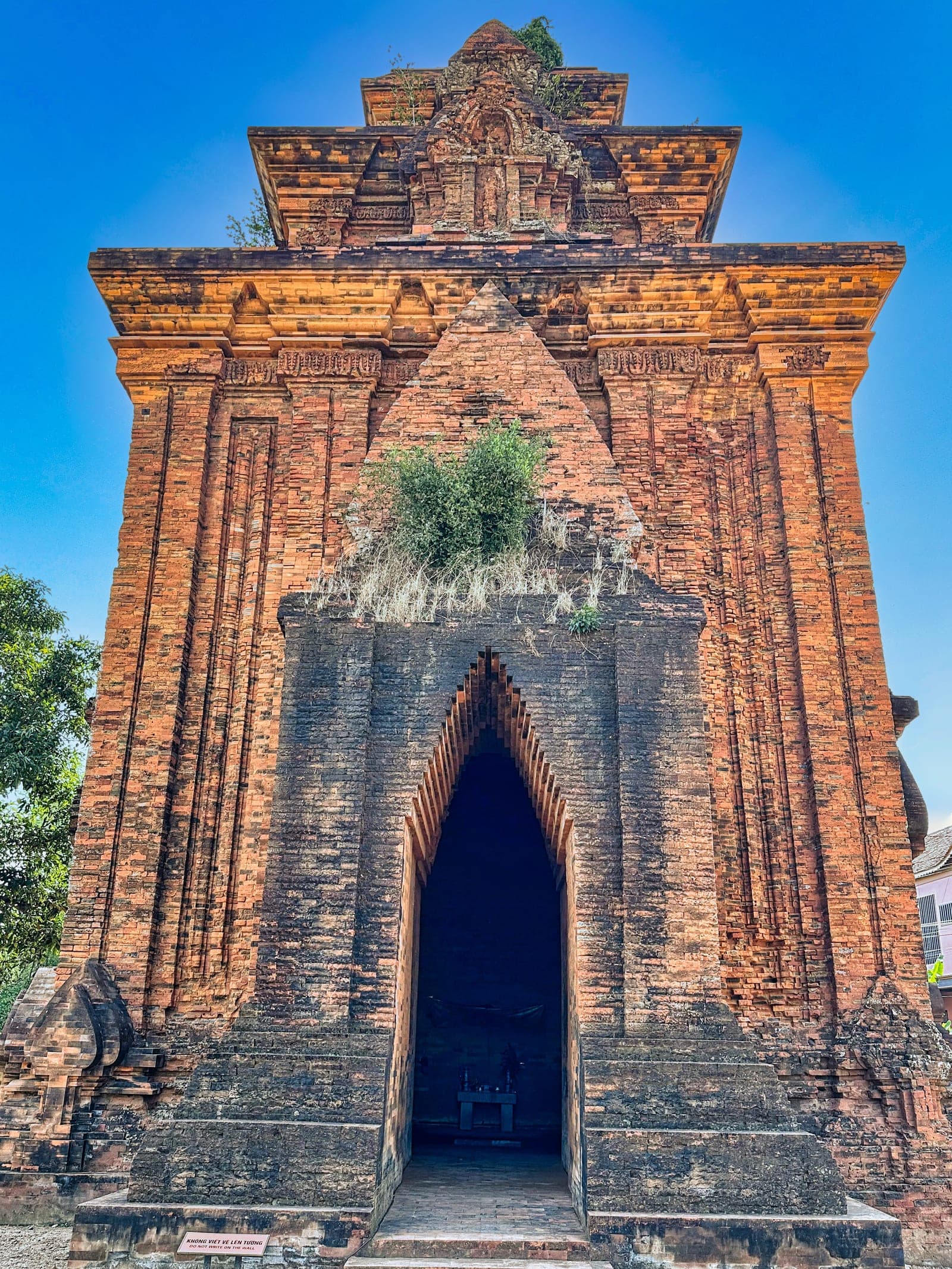 Historic brick Cham Hindu temple tower with intricate architectural masonry detailing, exemplifying Central Vietnamese Champa Kingdom heritage