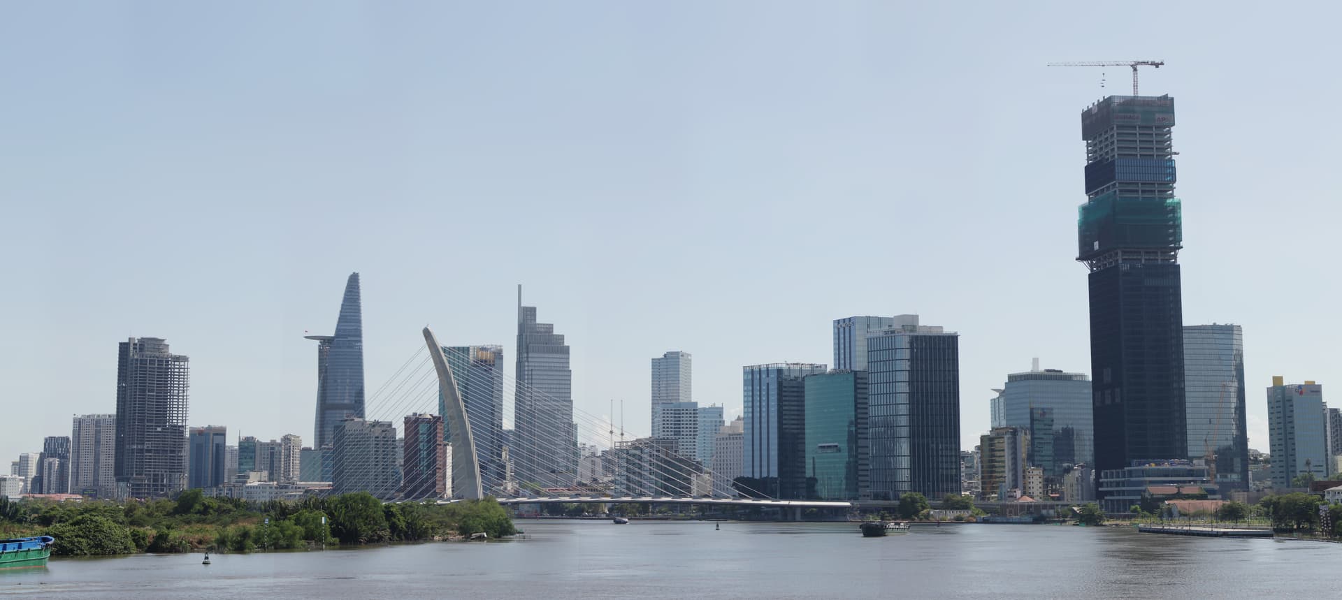 Ho Chi Minh City skyline featuring high-rise buildings and skyscrapers rising above the urban landscape, showing the city's modern commercial and financial development.
