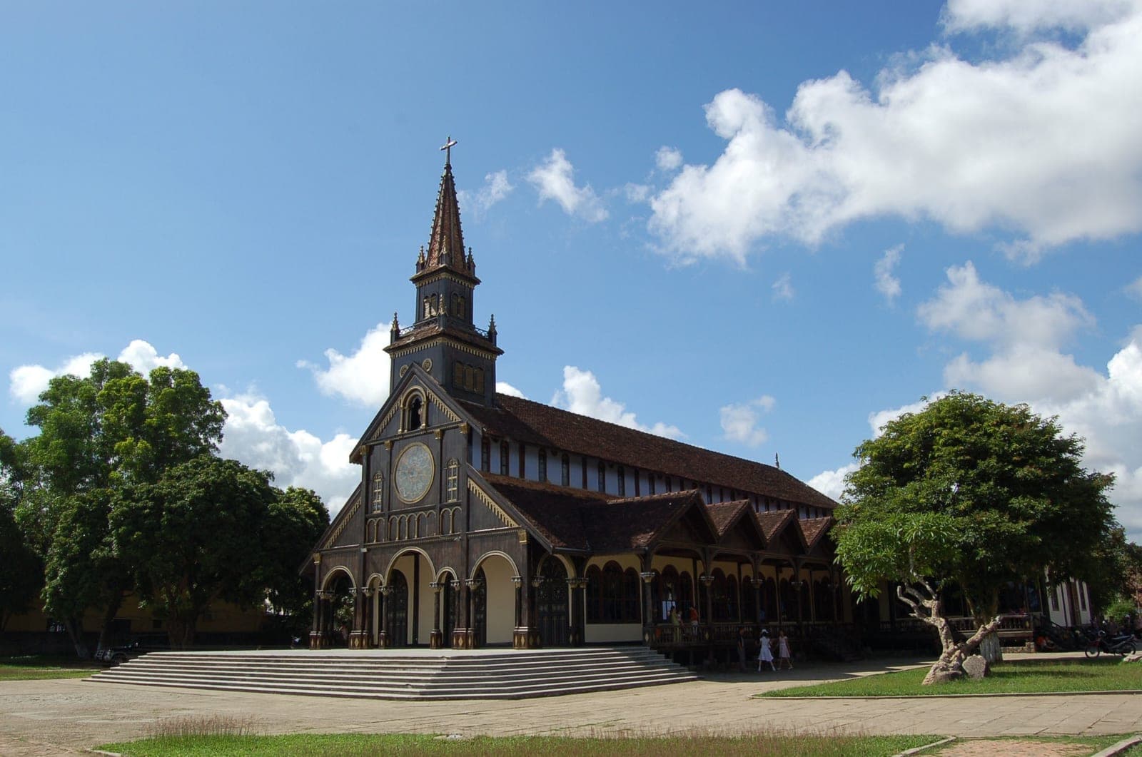 Traditional wooden Catholic cathedral in Kontum, Vietnam, featuring French colonial and Bahnar timber architecture in the Central Highlands.