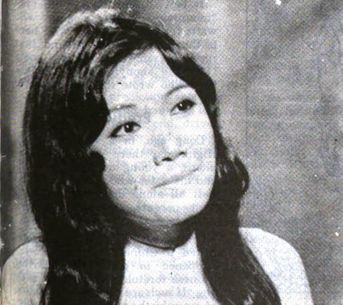 A young woman in vintage styling, portrait photograph from the era of South Vietnamese cinema and musical entertainment
