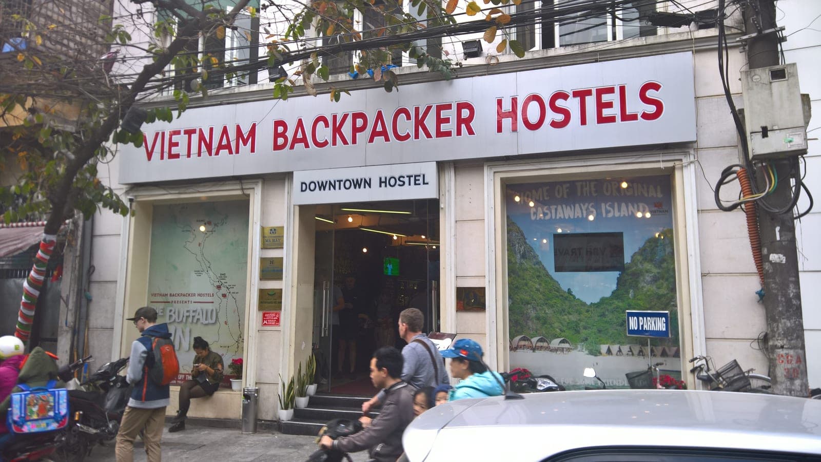Exterior of Vietnam Backpackers Hostel in Hanoi with bright signage marking the budget accommodation entrance.