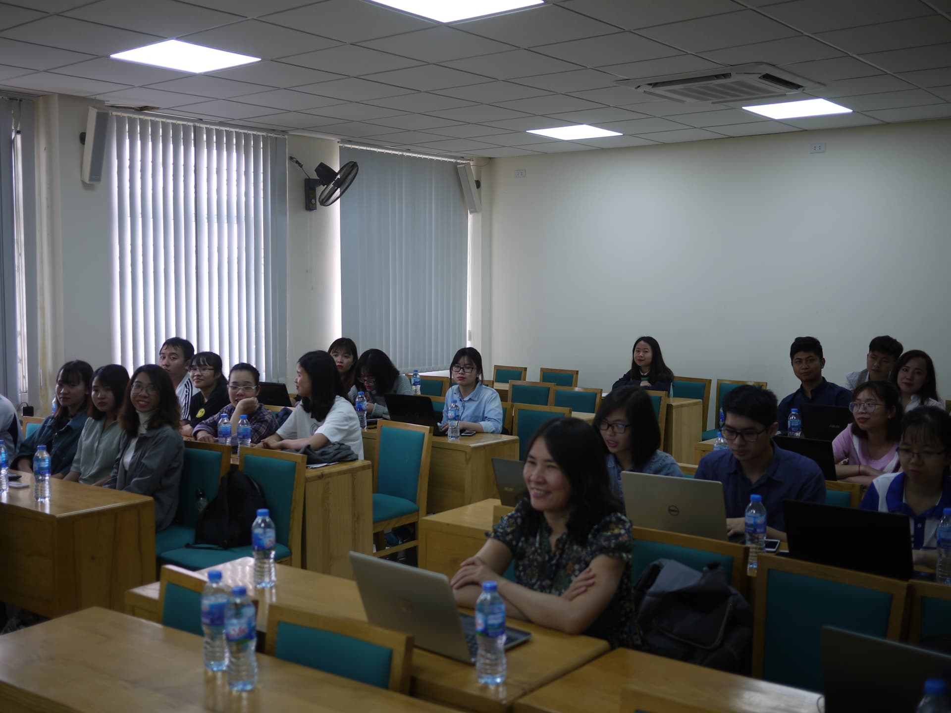 University classroom with students and instructor during a Wikipedia workshop at Vietnam National University's Economics and Business faculty.